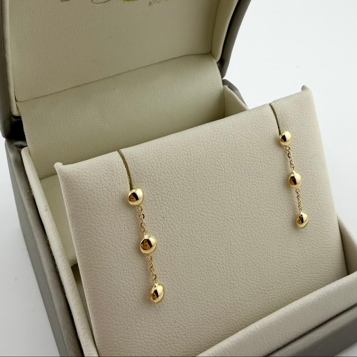 Orecchini pendenti con tre sfere - Oro 18 kt