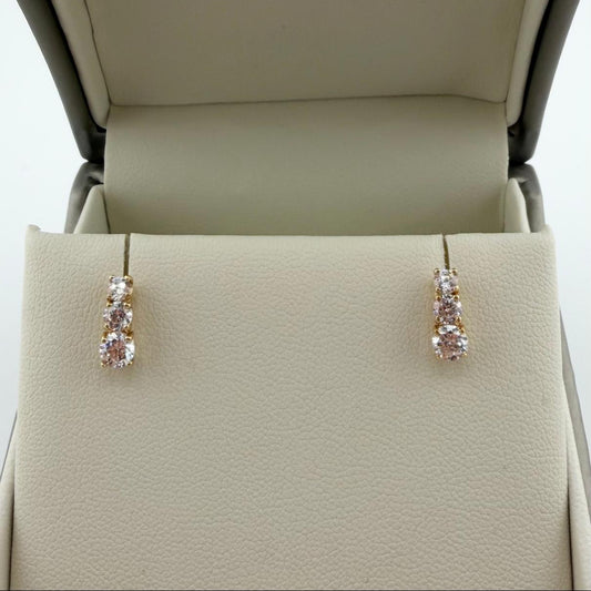 Orecchini trilogy con zirconi  - Oro 18kt