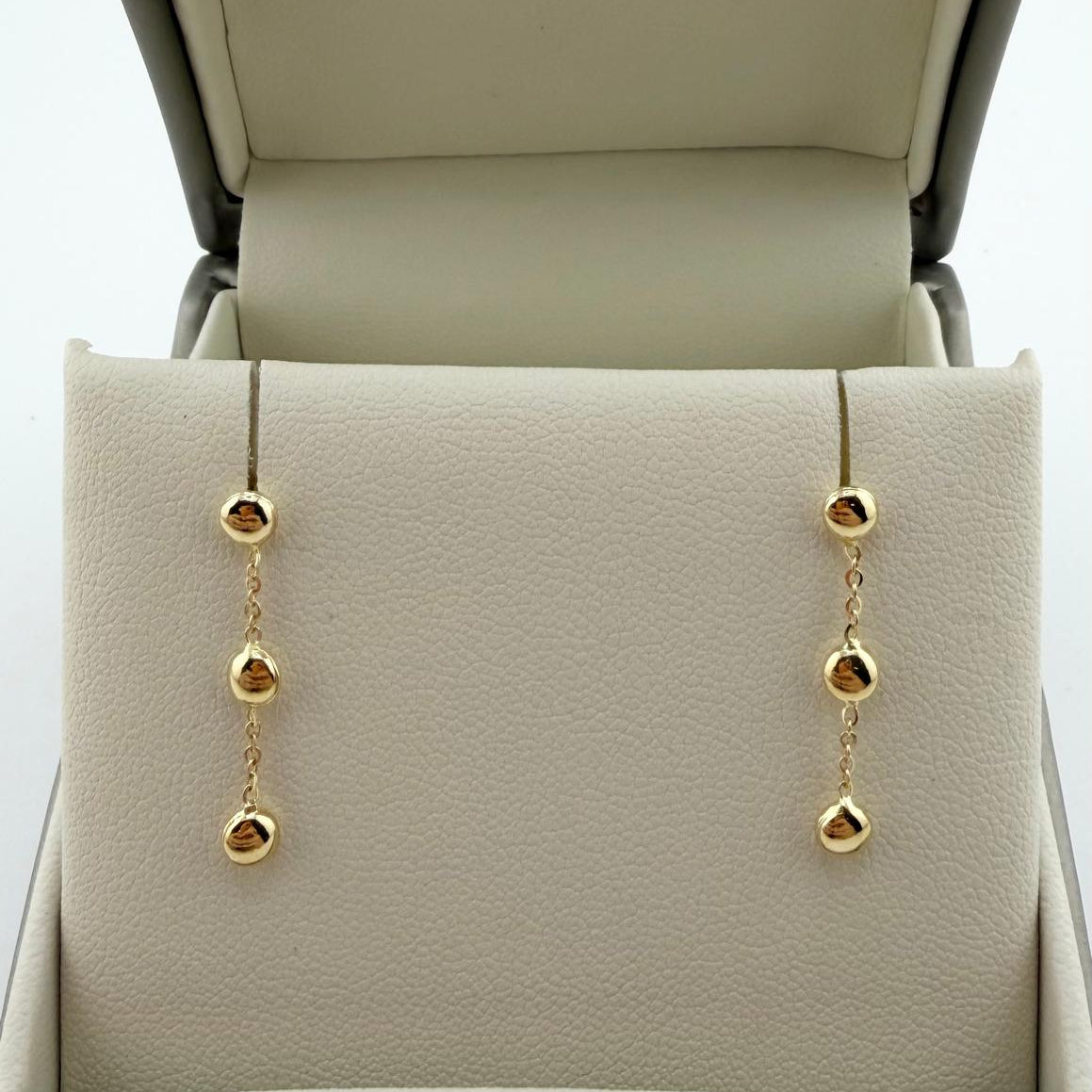 Orecchini pendenti con tre sfere - Oro 18 kt
