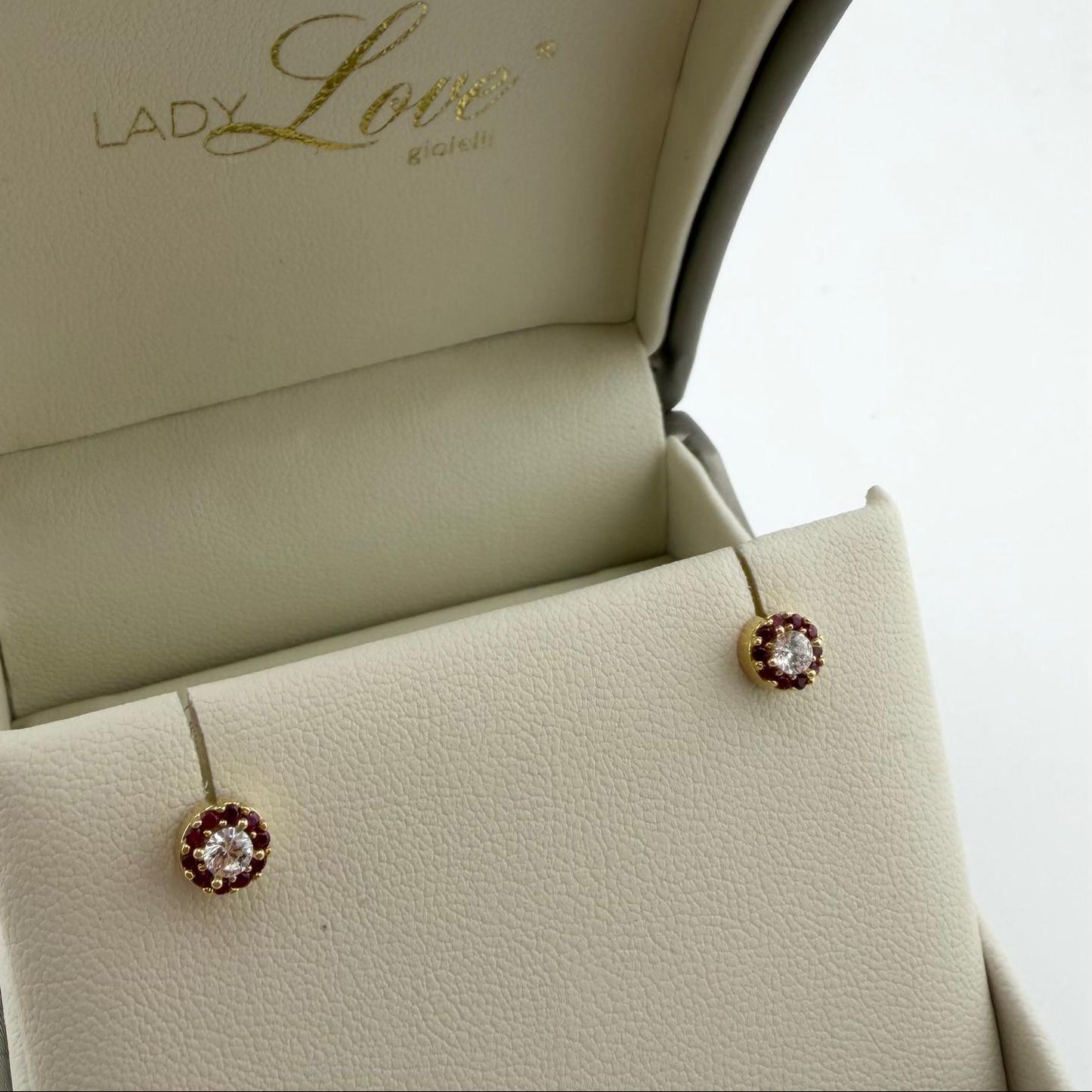 Orecchini punto luce con zirconi laterali - Oro 18 kt